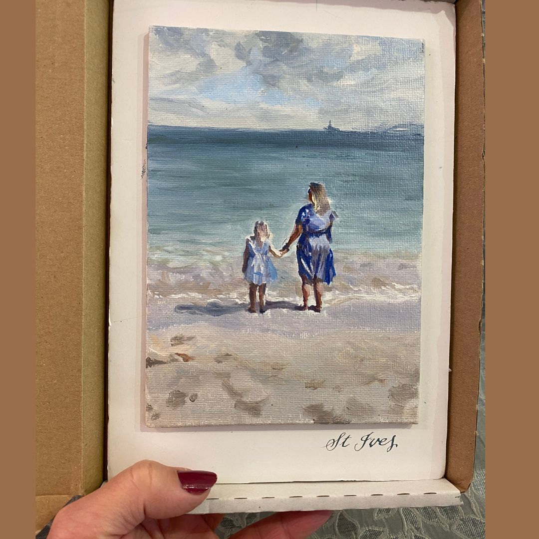Scale of mini oil painting in packaging of lady and her daughter gazing out across the horizon in an oil painting by Lorraine Field Art