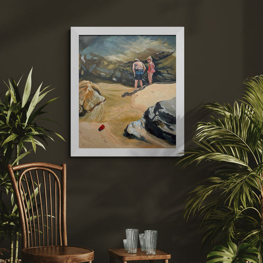 Oil painting Rockpool Explorers in a white wooden frame, hanging on a dark wall with wooden chair and green plants