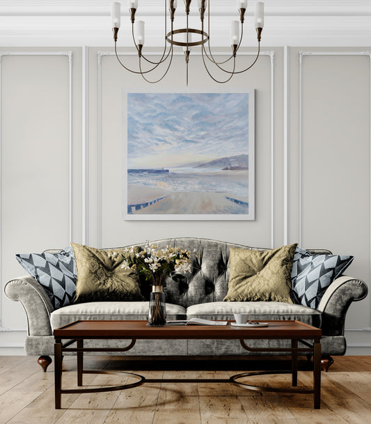 St Ives sunrise fine art print for large wall in white frame above velvet sofa in elegant living room.