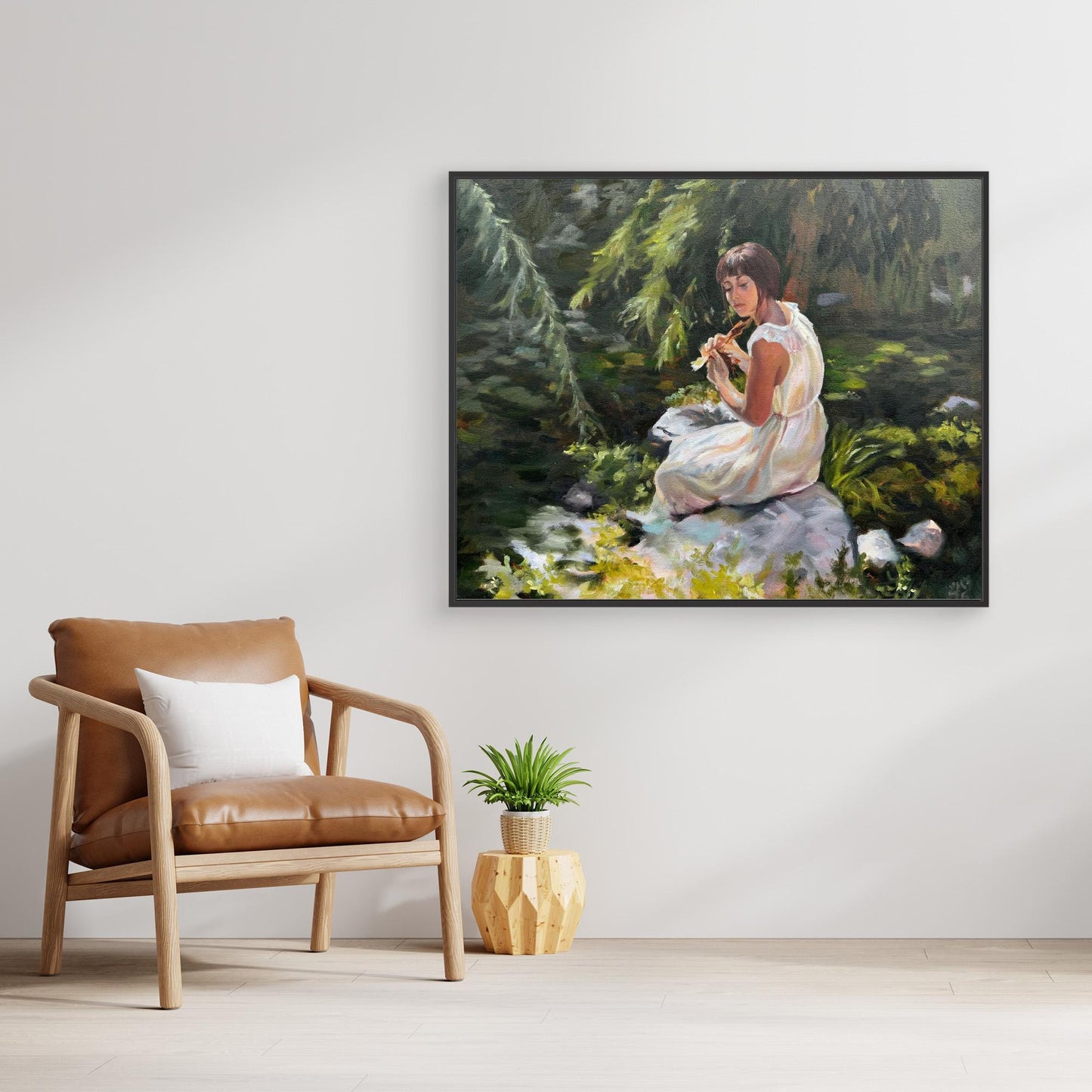 Stillness among the leaves - lady sitting by pond with lily pads - Canvas art print in black wooden frame room mockup