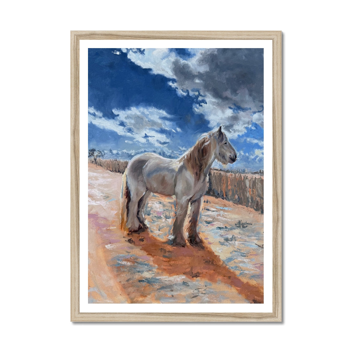 Framed artwork of a horse standing on a dirt path with a blue sky and clouds in the background.