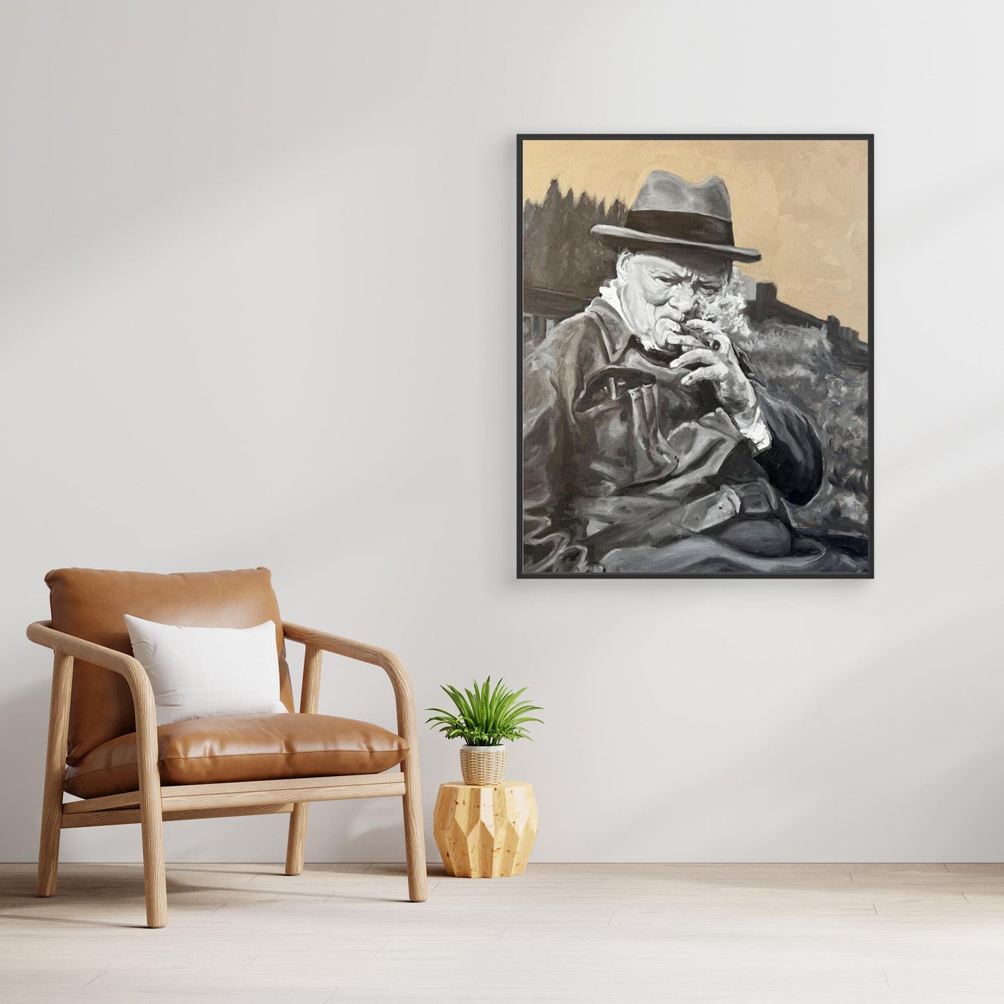 Black framed Winston Churchill portrait canvas print positioned beside a chair in a calm, neutral living space