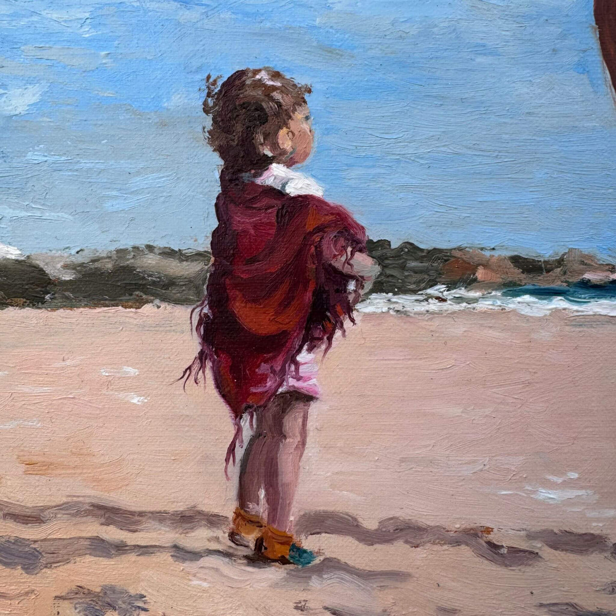 Detail of a young child wearing burgundy on a sandy beach in Mama, an original oil painting by Lorraine Field.
