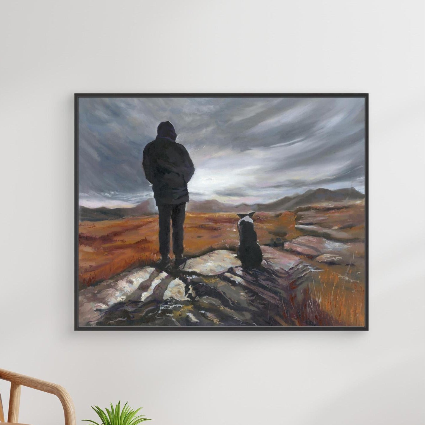 Canvas print “Man and His Border” with black frame, front view