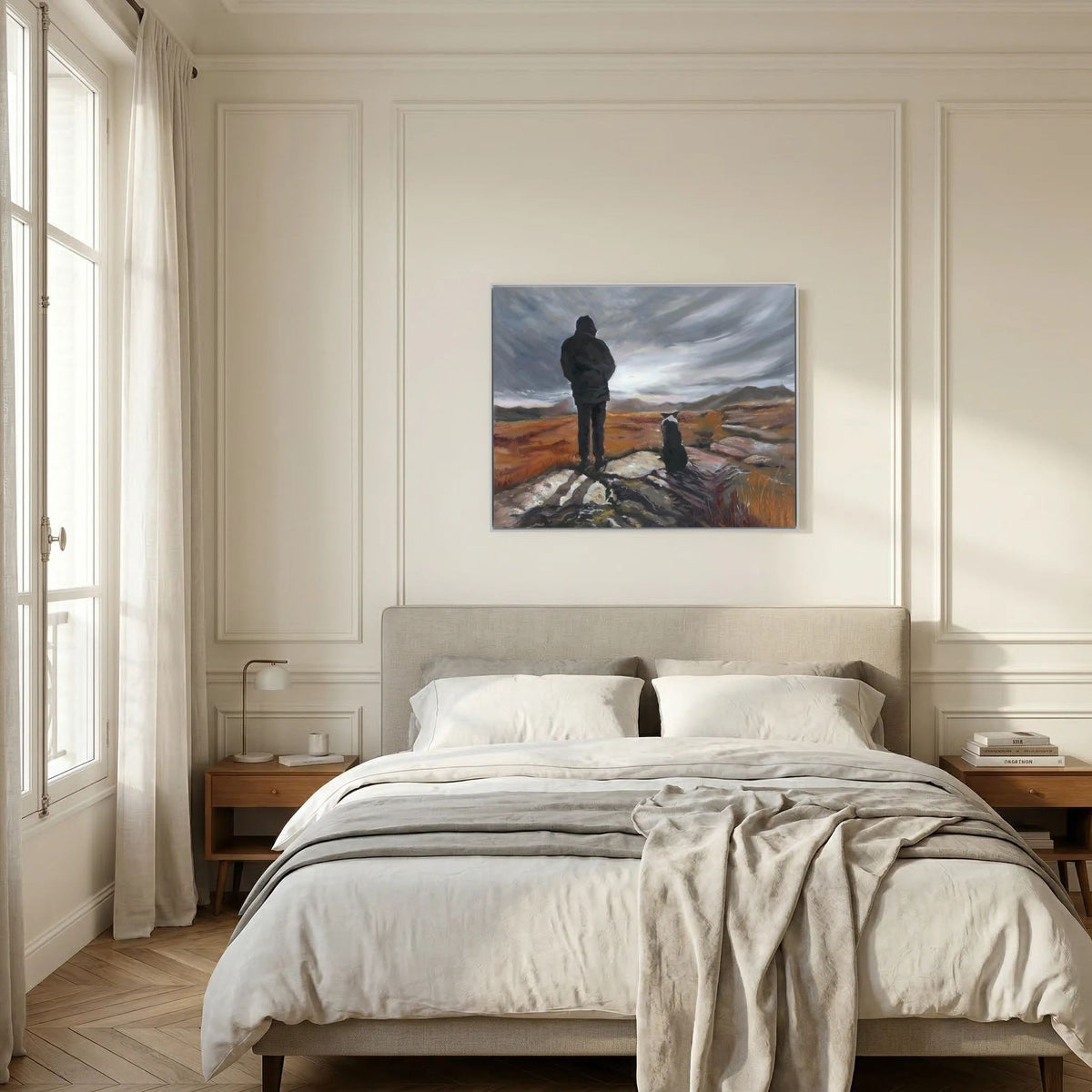 Man and His Border framed canvas print above a bed with neutral bedding against a white panelled wall.