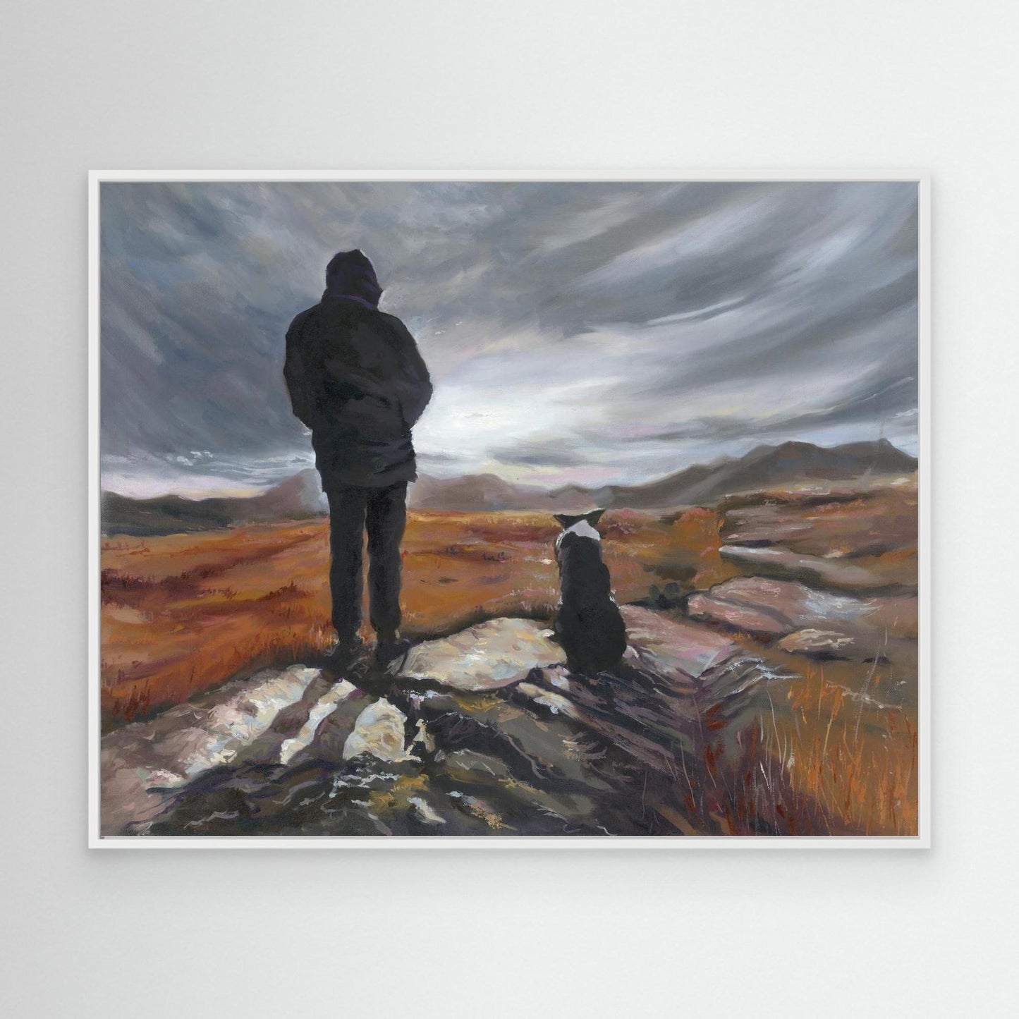 White framed “Man and His Border” canvas art