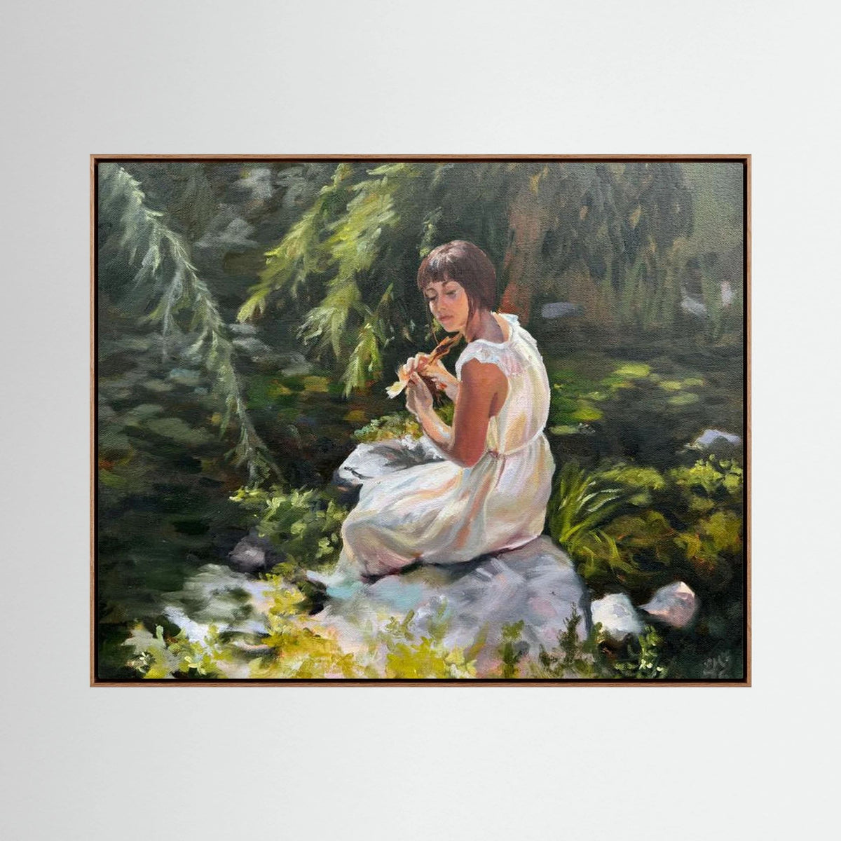 Stillness Among the Leaves canvas print by Lorraine Field in an oak frame, depicting a seated woman surrounded by lush green foliage.