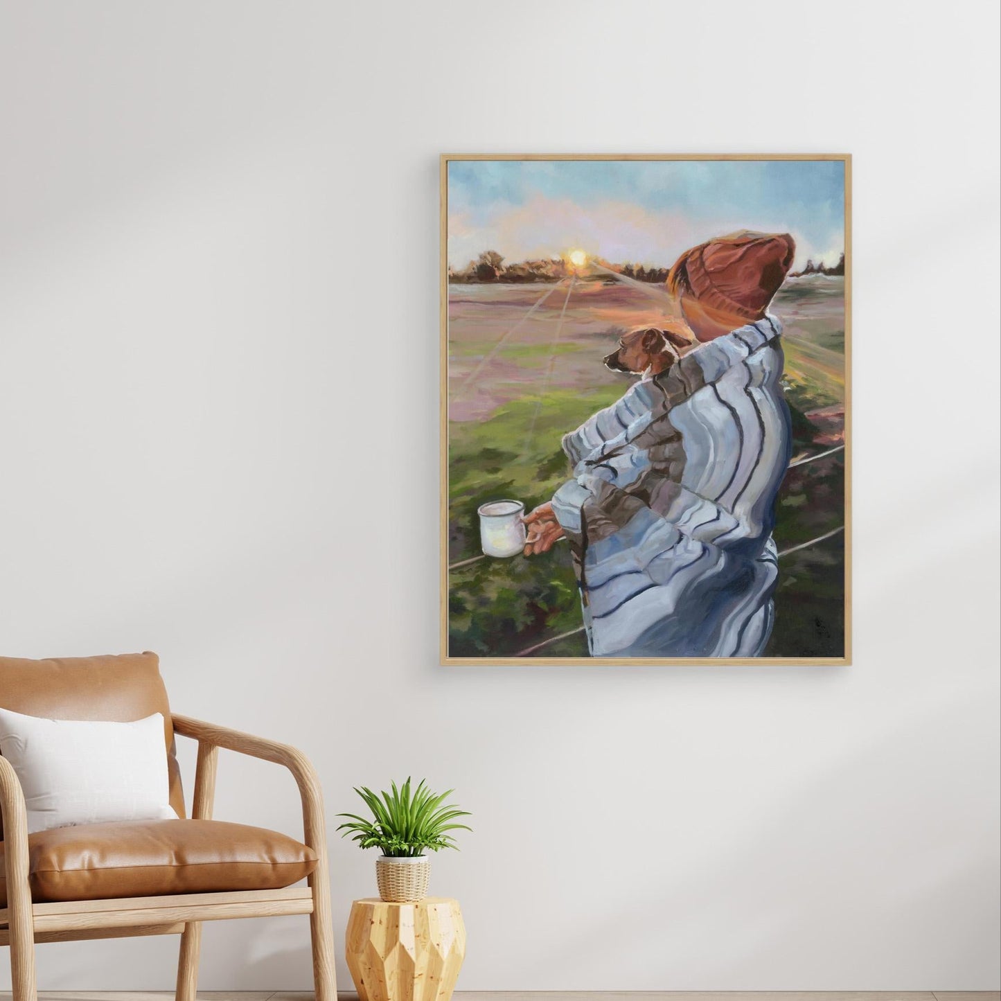 Oak framed Sunrise with the Pup canvas art, celebrating quiet morning moments between a woman, her jack russell, and the rising sun.