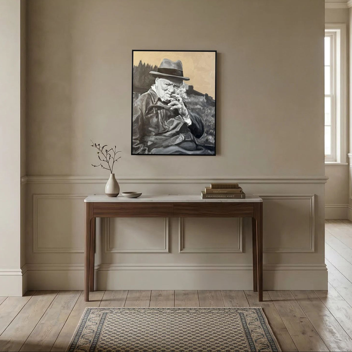 Winston Churchill framed canvas print displayed above a wooden console table in a neutral interior with rug
