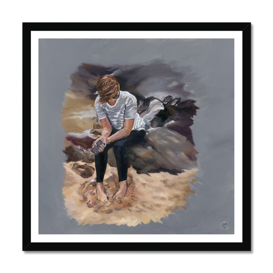 Fine art print depicting a young woman sitting barefoot on a rock by the beach, holding a mobile phone and looking off to the distance.