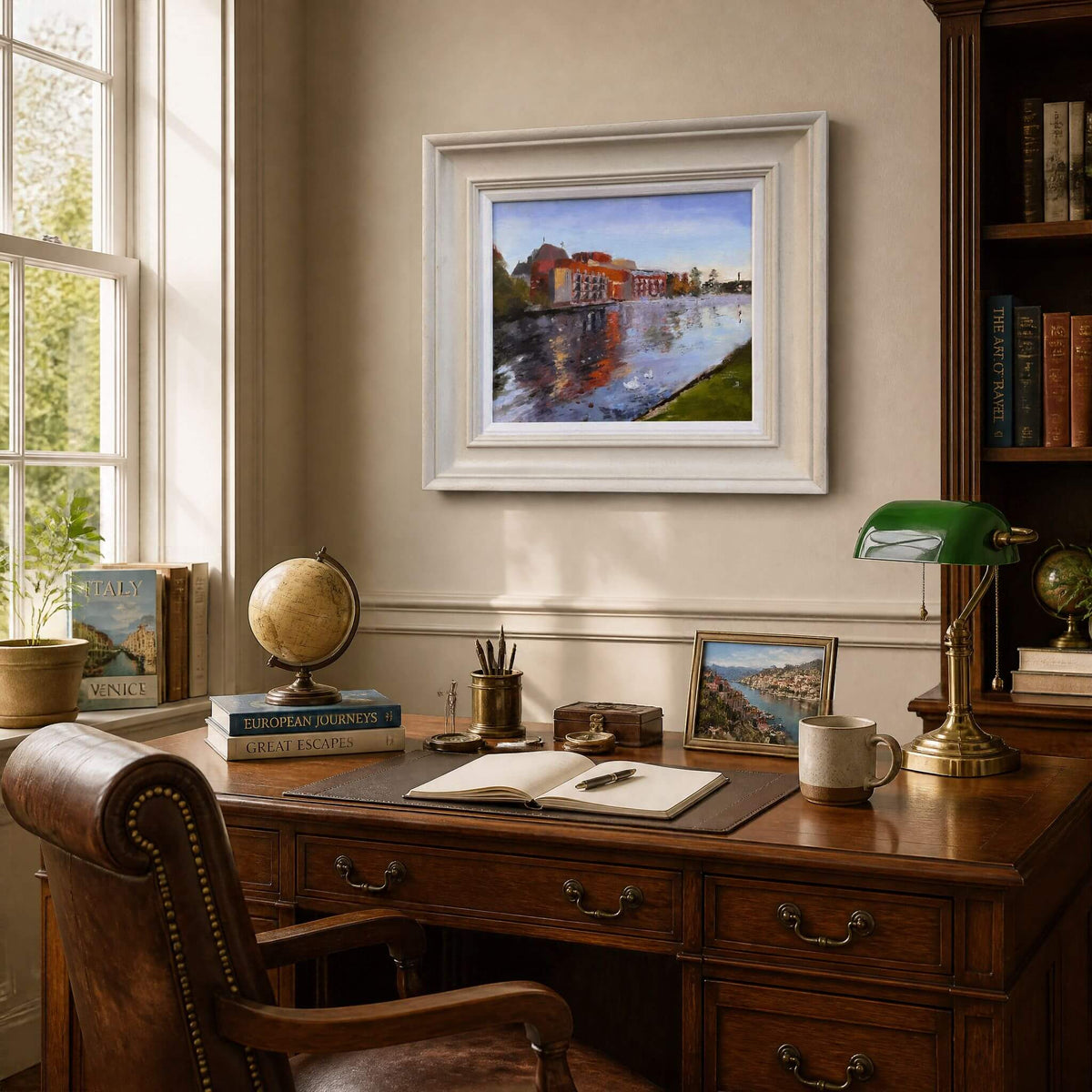 Autumn Colours at the RSC oil painting in a pale painted frame, displayed above a wooden desk in a study mock-up.