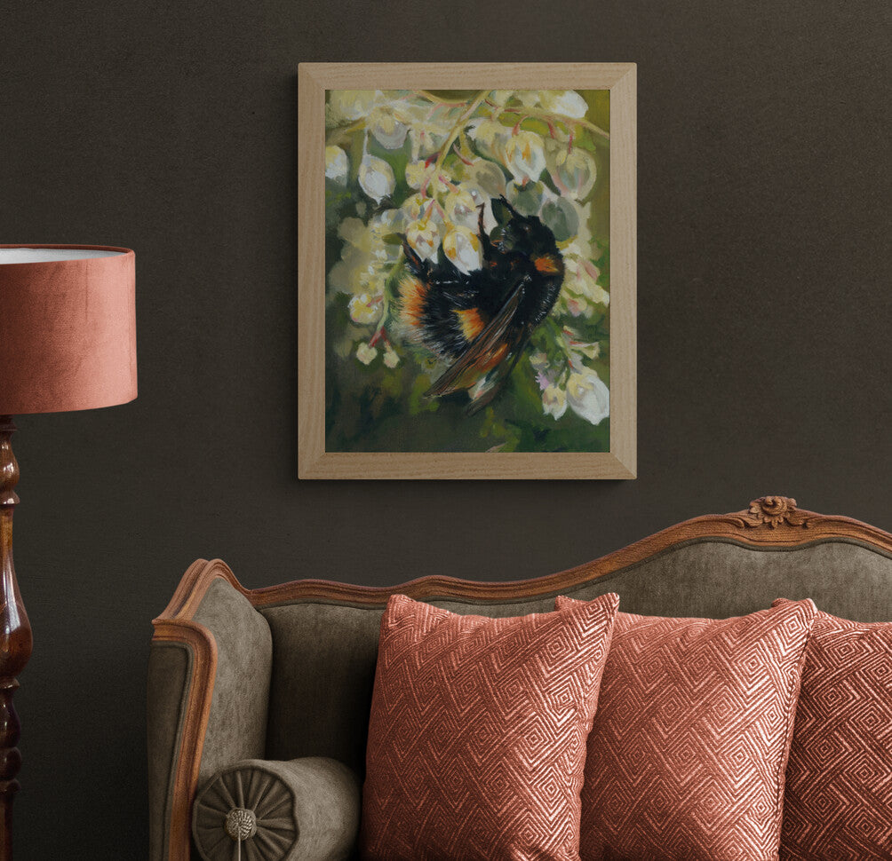 Bee on Honeysuckle Fine Art Print shown in natural frame option above sofa