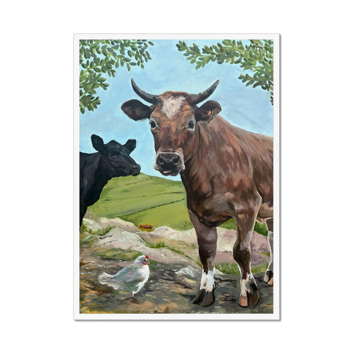 Cheeky Cows art print in a white frame, with two cows and a white chicken in a cheerful countryside scene.