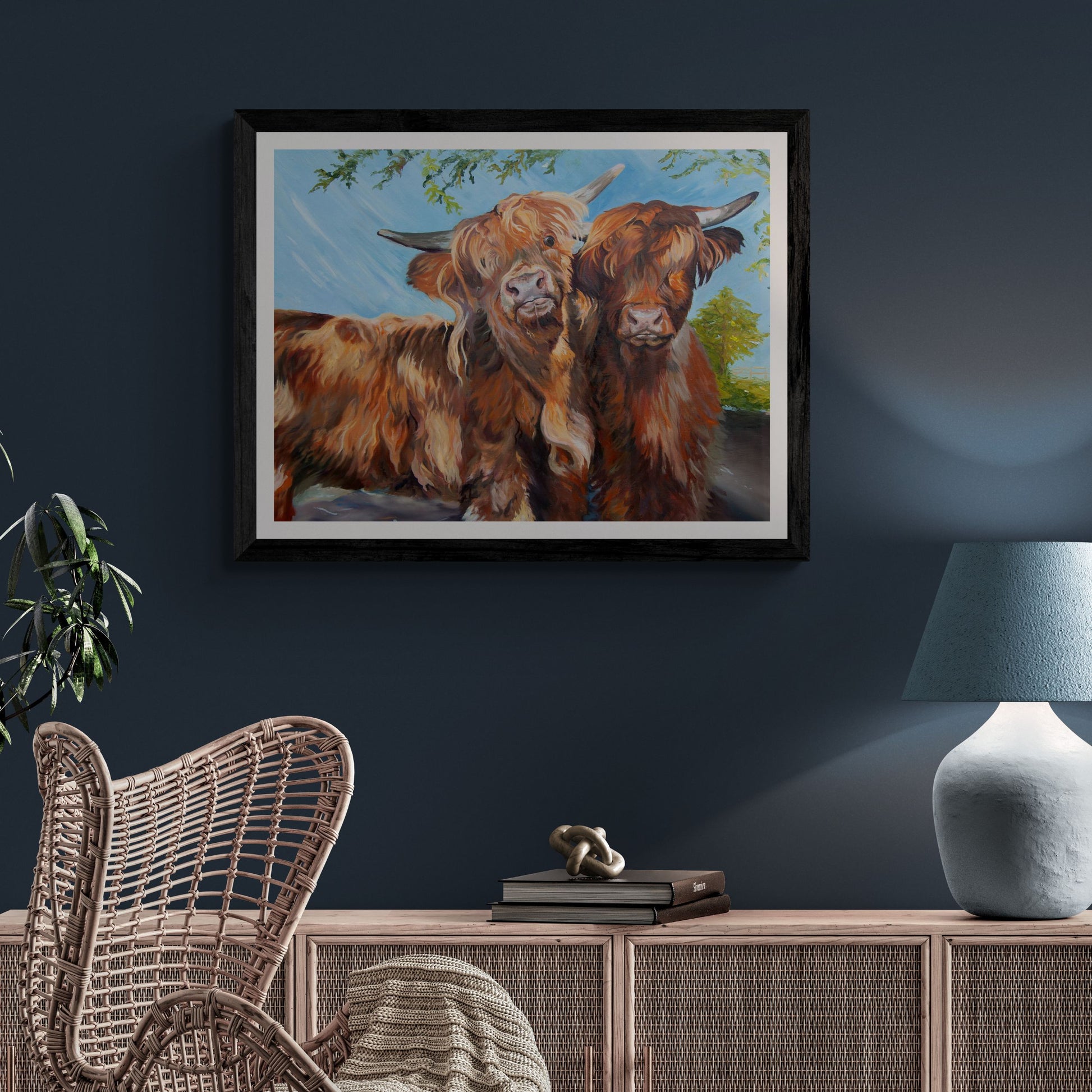 Funny Highland cow print in black frame on dark blue wall