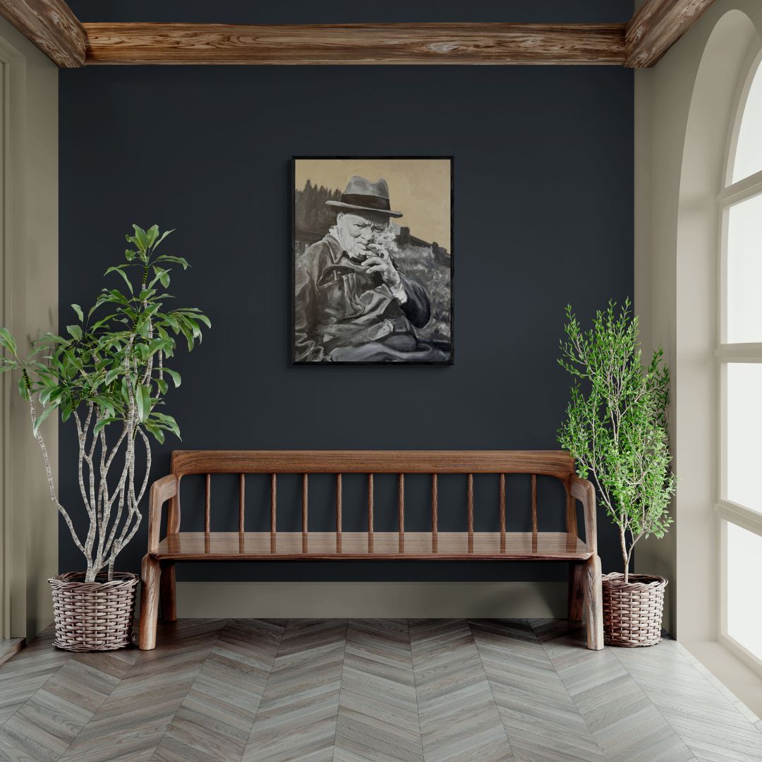 Black framed Winston Churchill portrait canvas print placed above a wooden bench in a warm, traditional interior with natural textures and plants