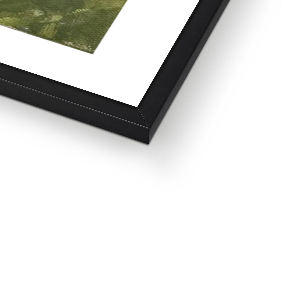 Close-up of a black-framed horse picture on a white surface