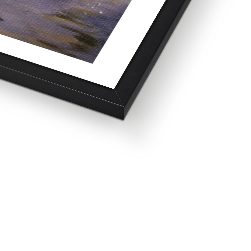 Corner of black framed artwork on a white surface