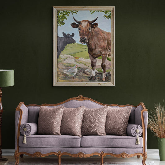 Cow canvas art displayed on a deep green wall above a sofa
