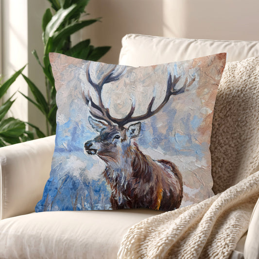 Echoes of the Wild stag cushion styled on a neutral sofa – adds warmth and quiet strength to your space.