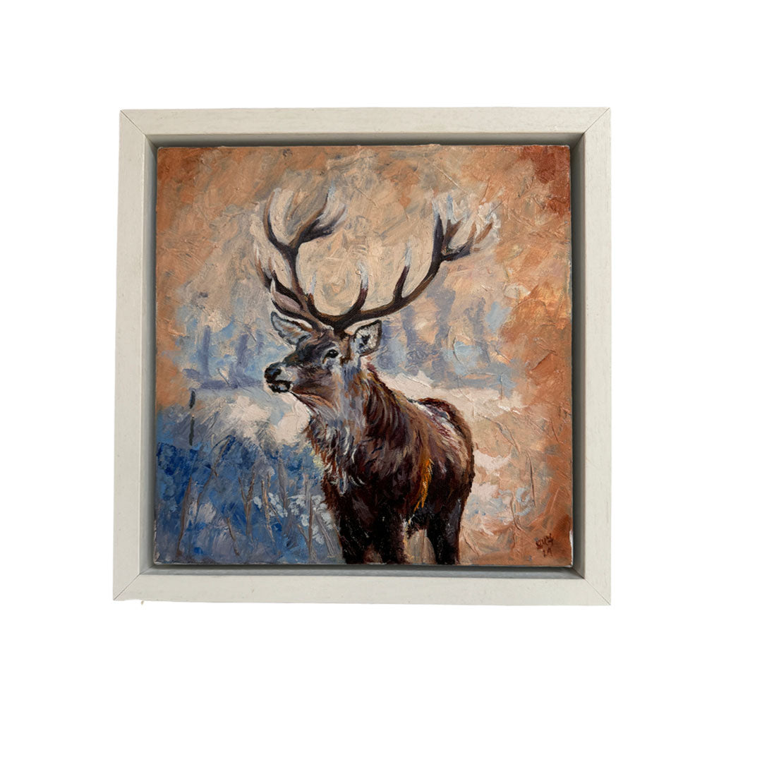 Small oil painting of a majestic stag standing gracefully against a mystical blue and brown background. The artwork features detailed brushwork highlighting the stag's antlers and fur with ethereal tones of the abstract forest-like backdrop. Perfect for nature and wildlife art enthusiasts. 