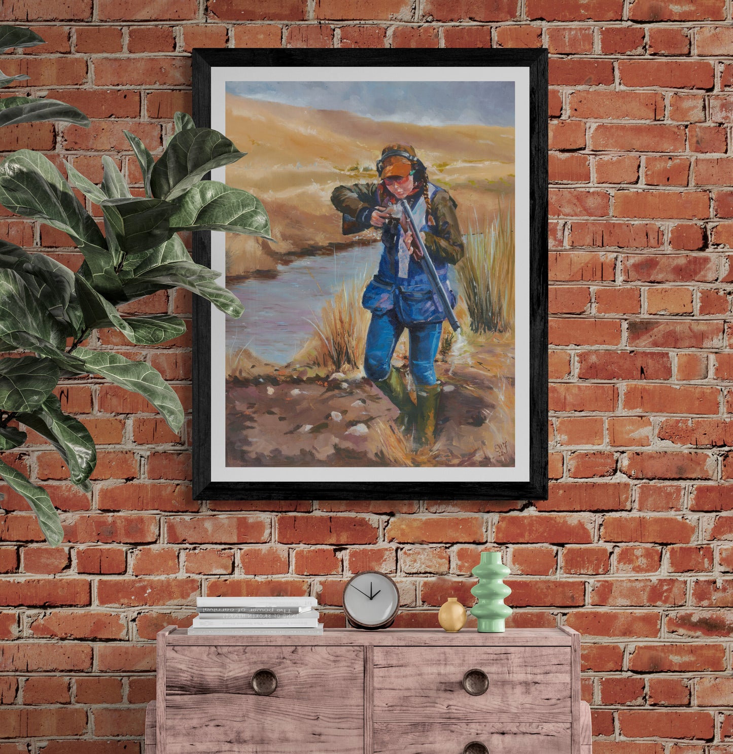 Girl power - clay pigeon shooting for girls - fine art print displayed in black frame on brick wall