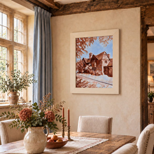 An original oil painting depicting Shakespeare's daughter's former home, Hall's Croft,hanging on a beige wall in a rustic dining room setting with timber beams