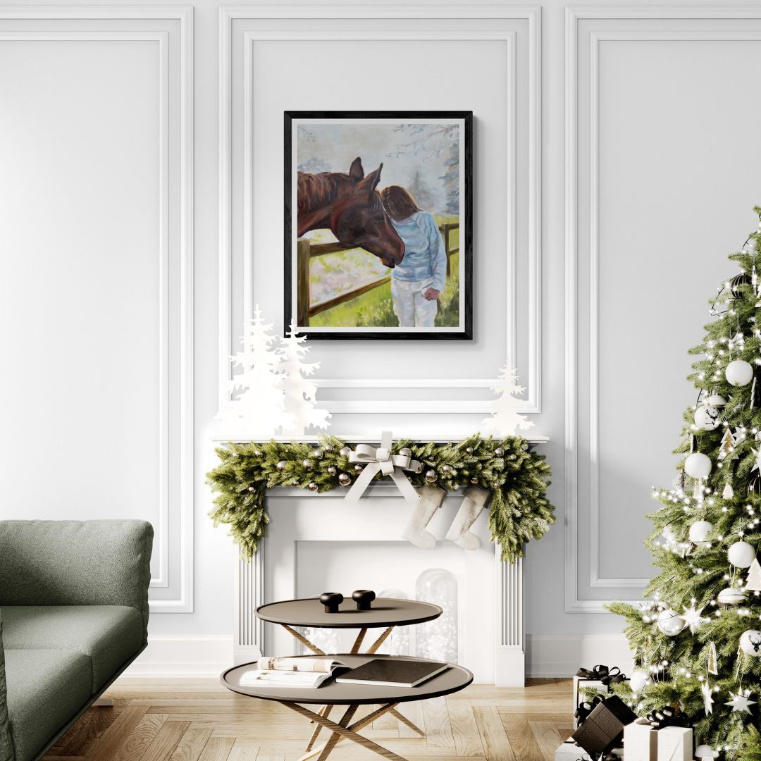 Living room with a Christmas tree, sofa, and framed horse picture with person.