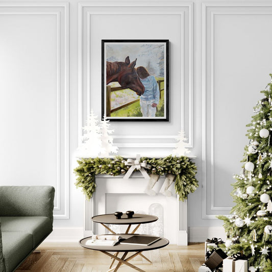 Living room with a Christmas tree, sofa, and framed horse picture with person.