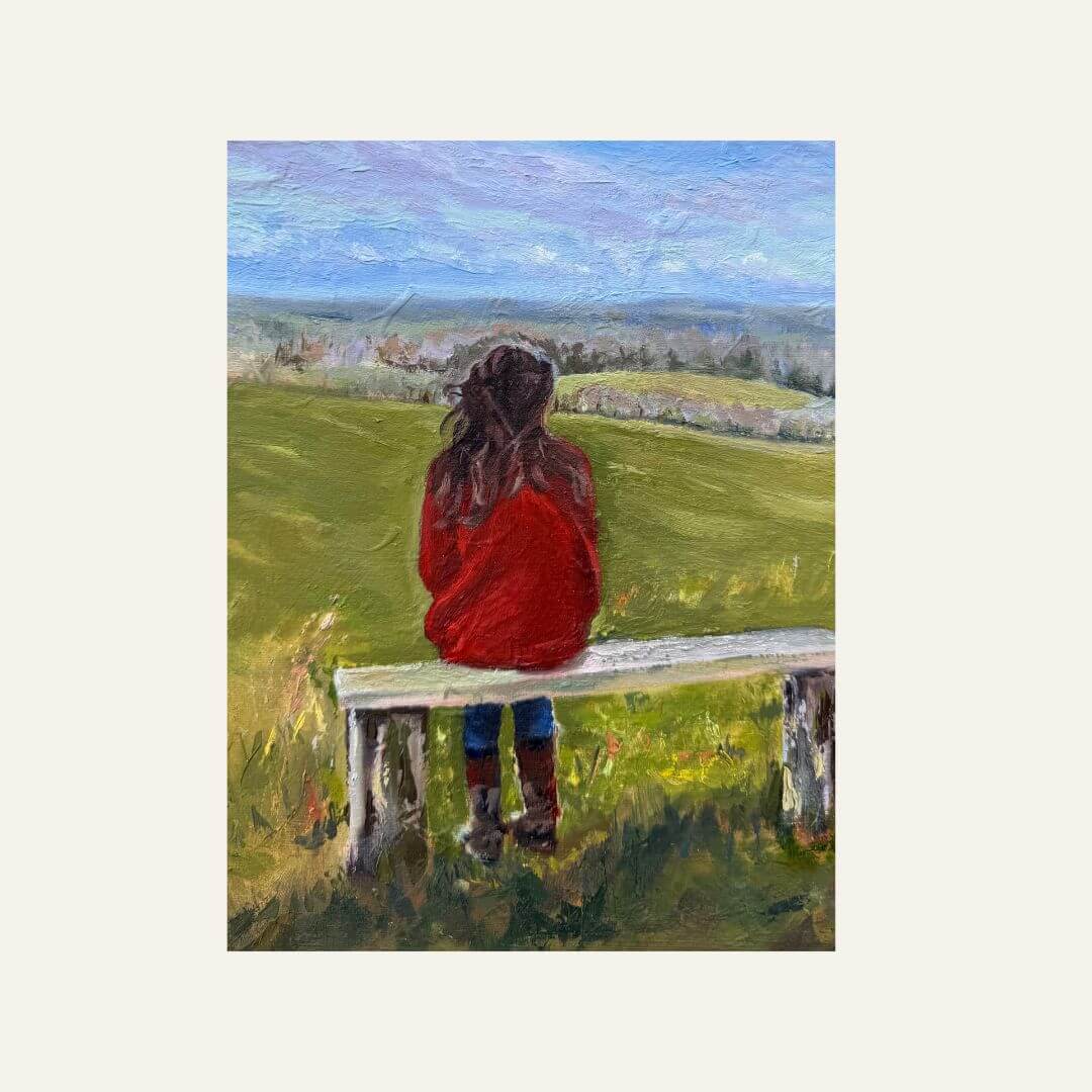 If Fields Could Talk original oil painting of a woman seated on a white bench, looking across rolling green countryside.