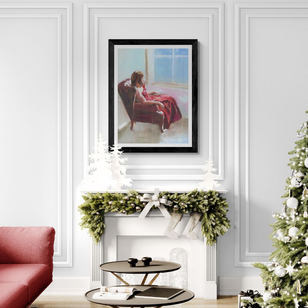Living room with a red sofa, Christmas tree, and framed Lady in Red dress artwork above a fireplace.