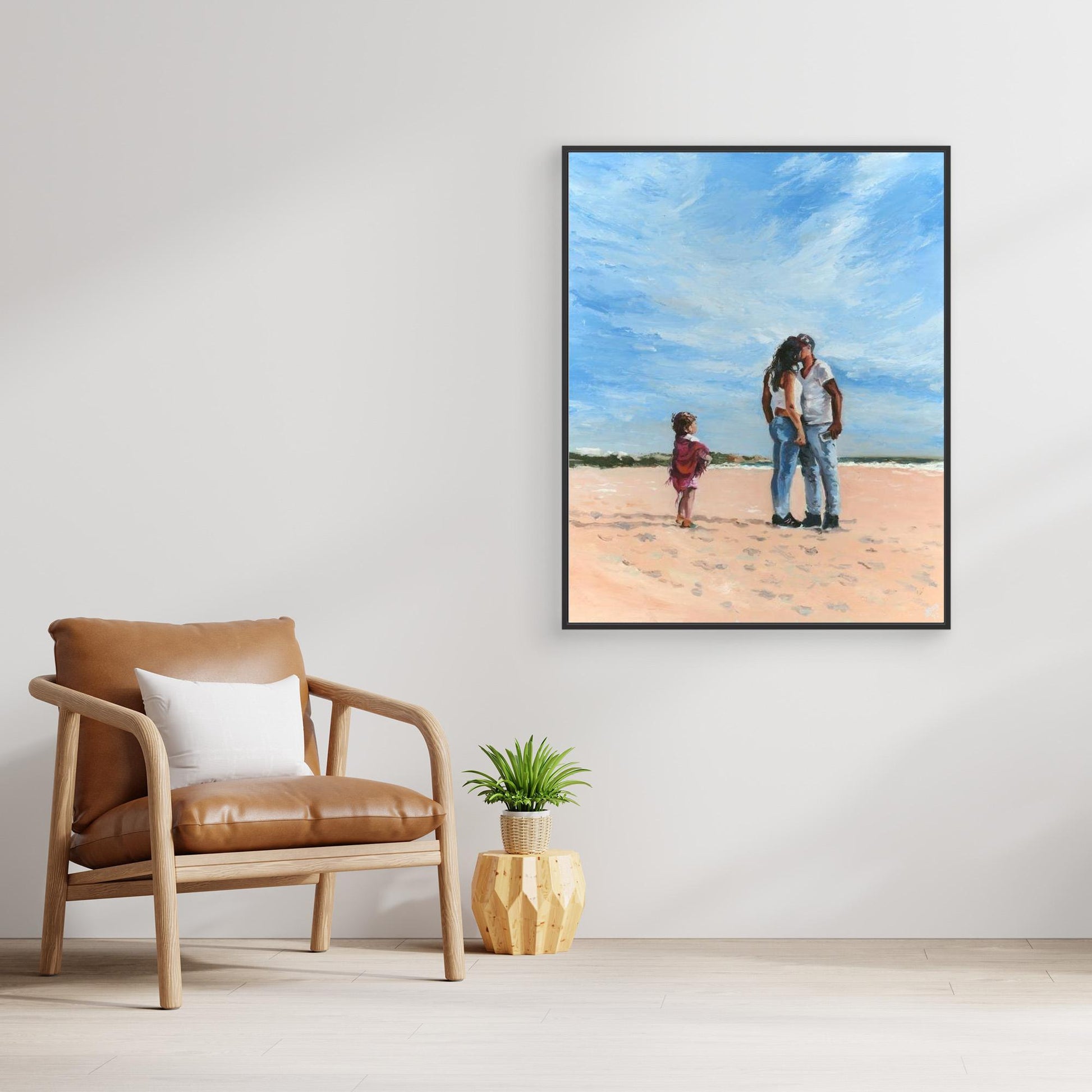 'Mama' black framed canvas print displayed above a chair beside a potted plant, a striking and emotive focal point.