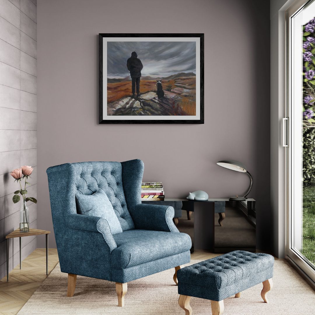 Man and Border art print in black frame option great for a man cave, above blue armchair by window.