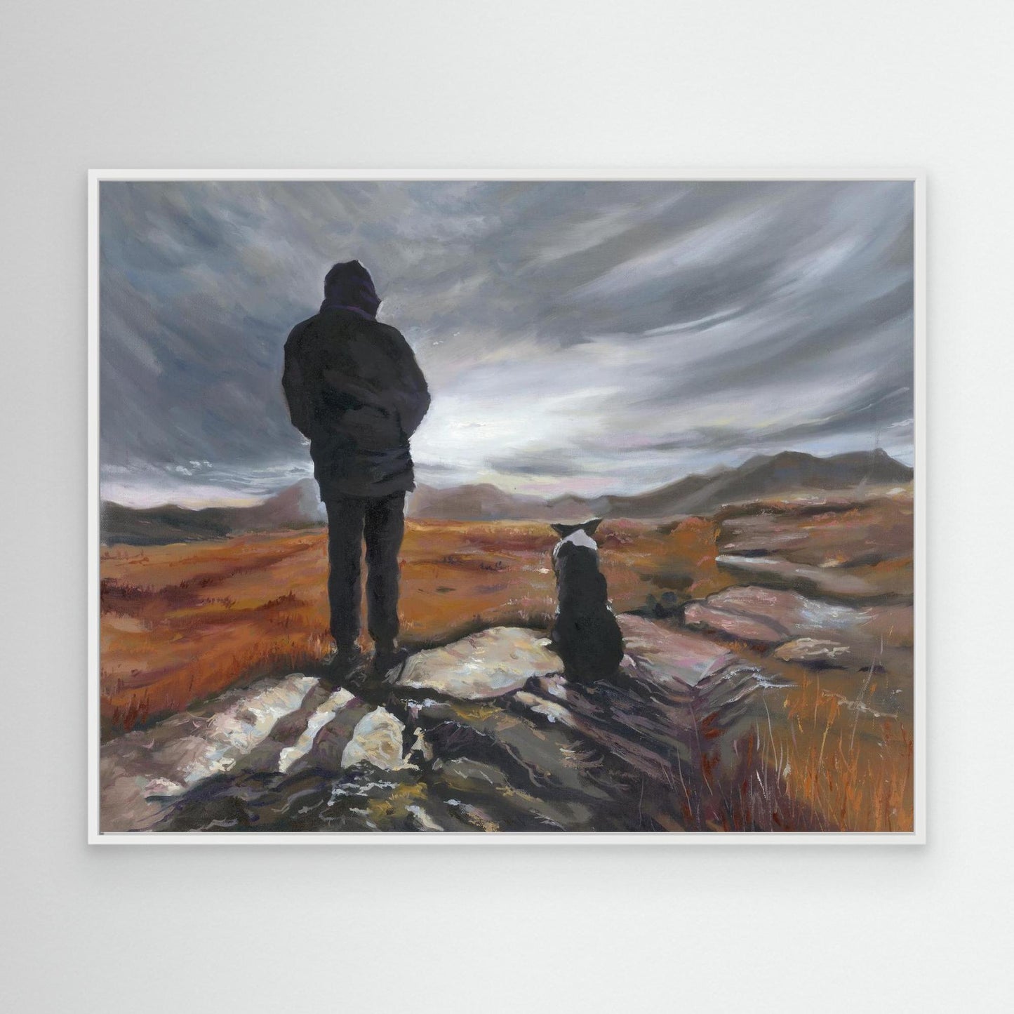 Border Collie canvas art print with his owner standing on a craggy rock with a dramatic sky beyond.