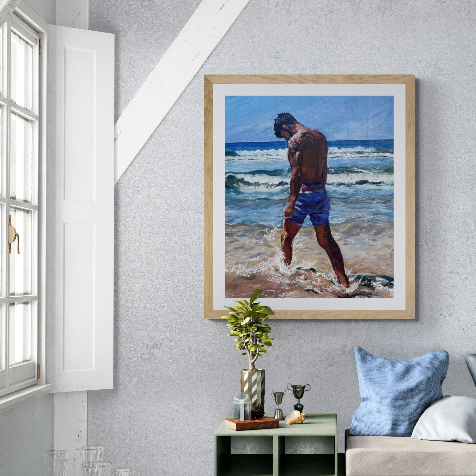 Man walking alone through foamy surf on a Cornwall beach. Emotional coastal fine art print exploring love, longing, memory, and reflection.