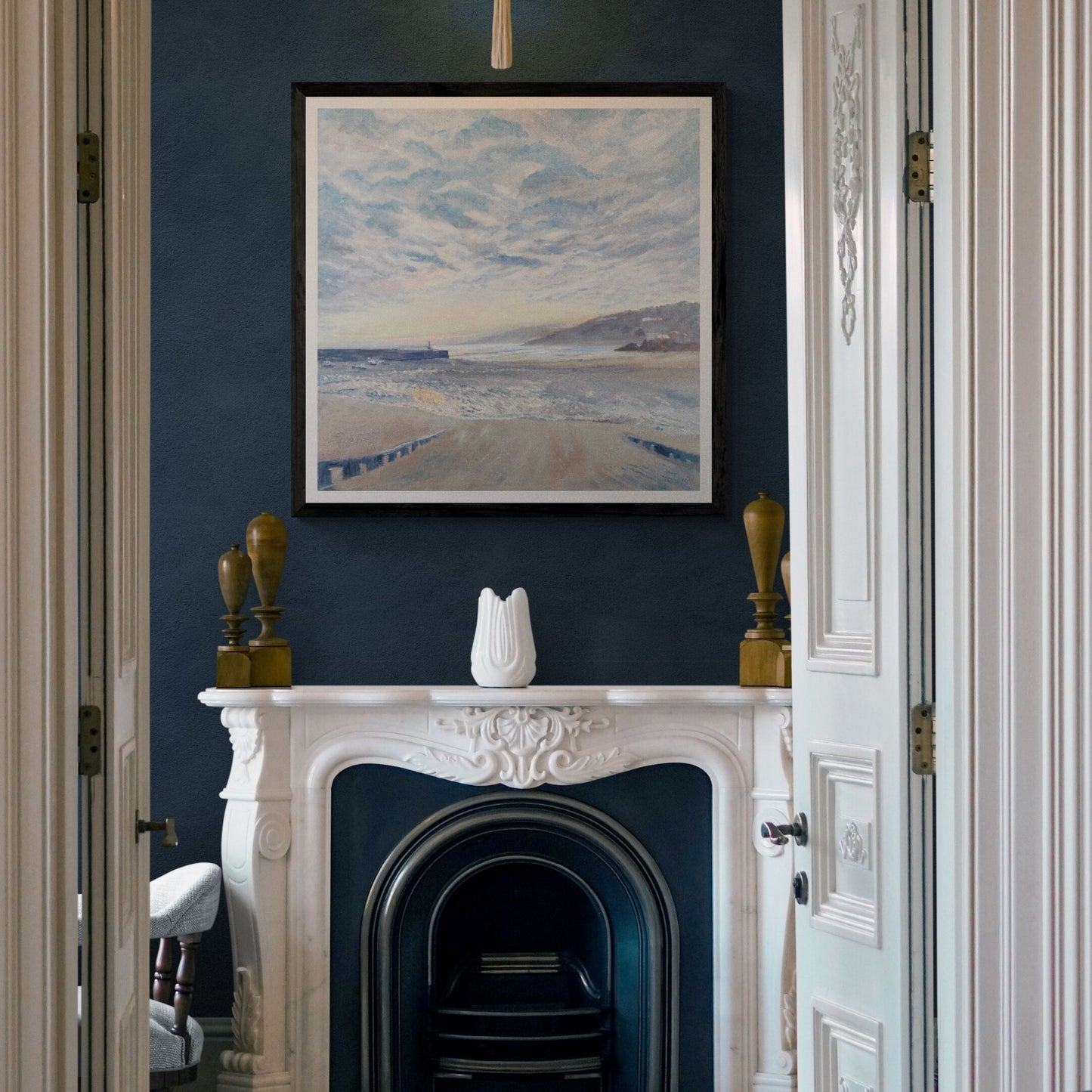 St Ives Sunrise Art print on deep blue wall above fireplace