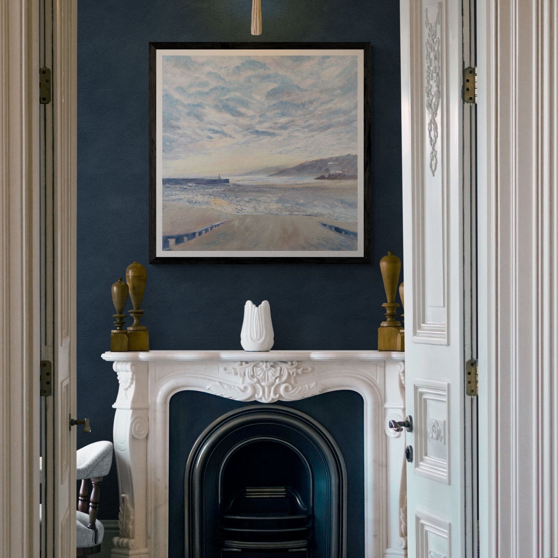 St Ives Sunrise Art print on deep blue wall above fireplace