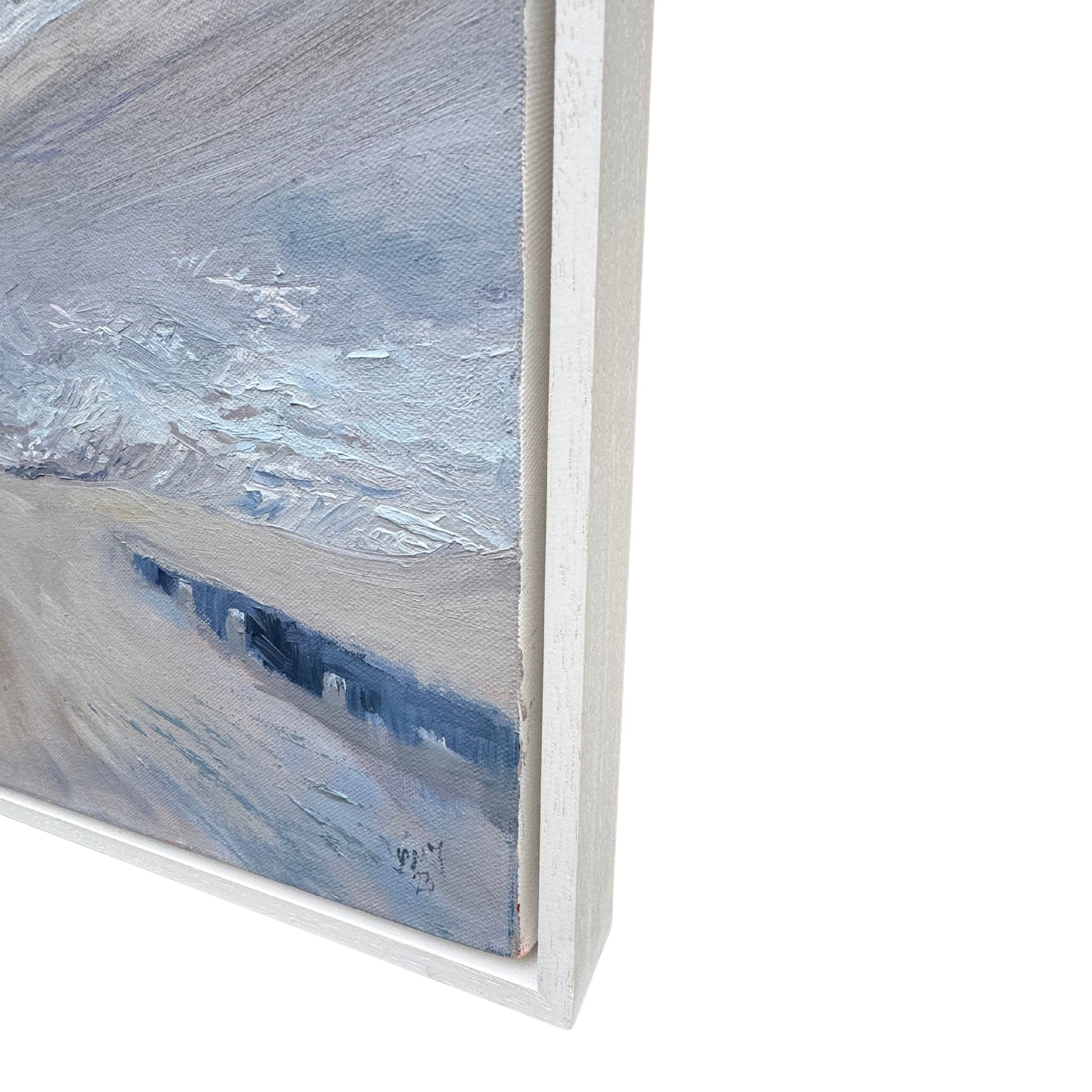 Close-up of white wooden frame of a textured seascape painting of St Ives Harbour with blue and grey tones on a white background