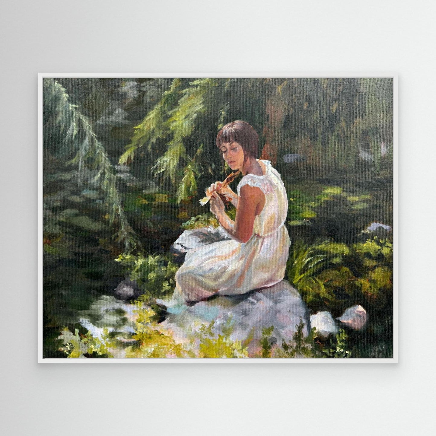 White framed emotional woodland canvas wall art bringing calm green tones and nature-inspired atmosphere into a room.