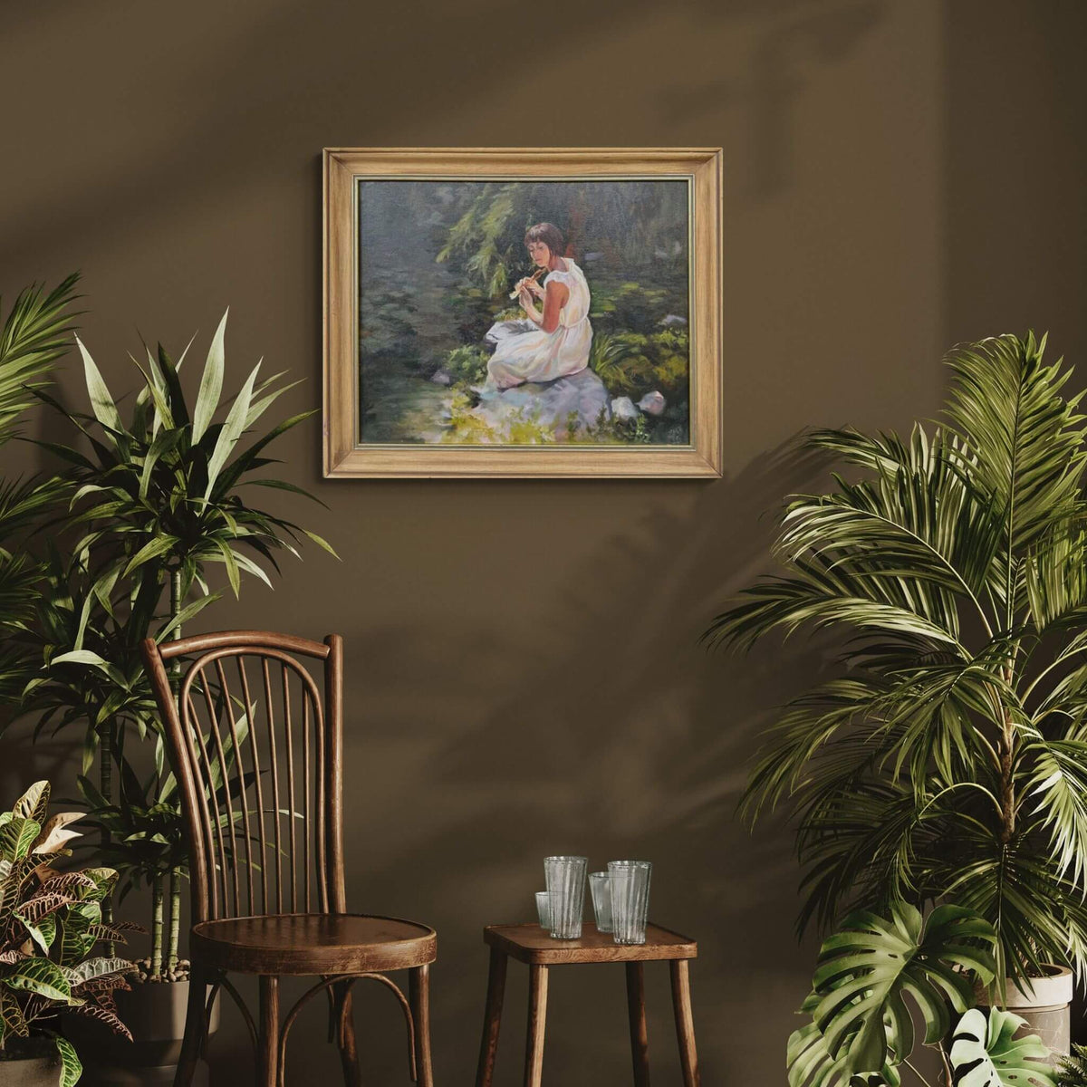 Stillness Among the Leaves oil painting displayed on a dark green wall in a styled room with plants and a wooden chair.