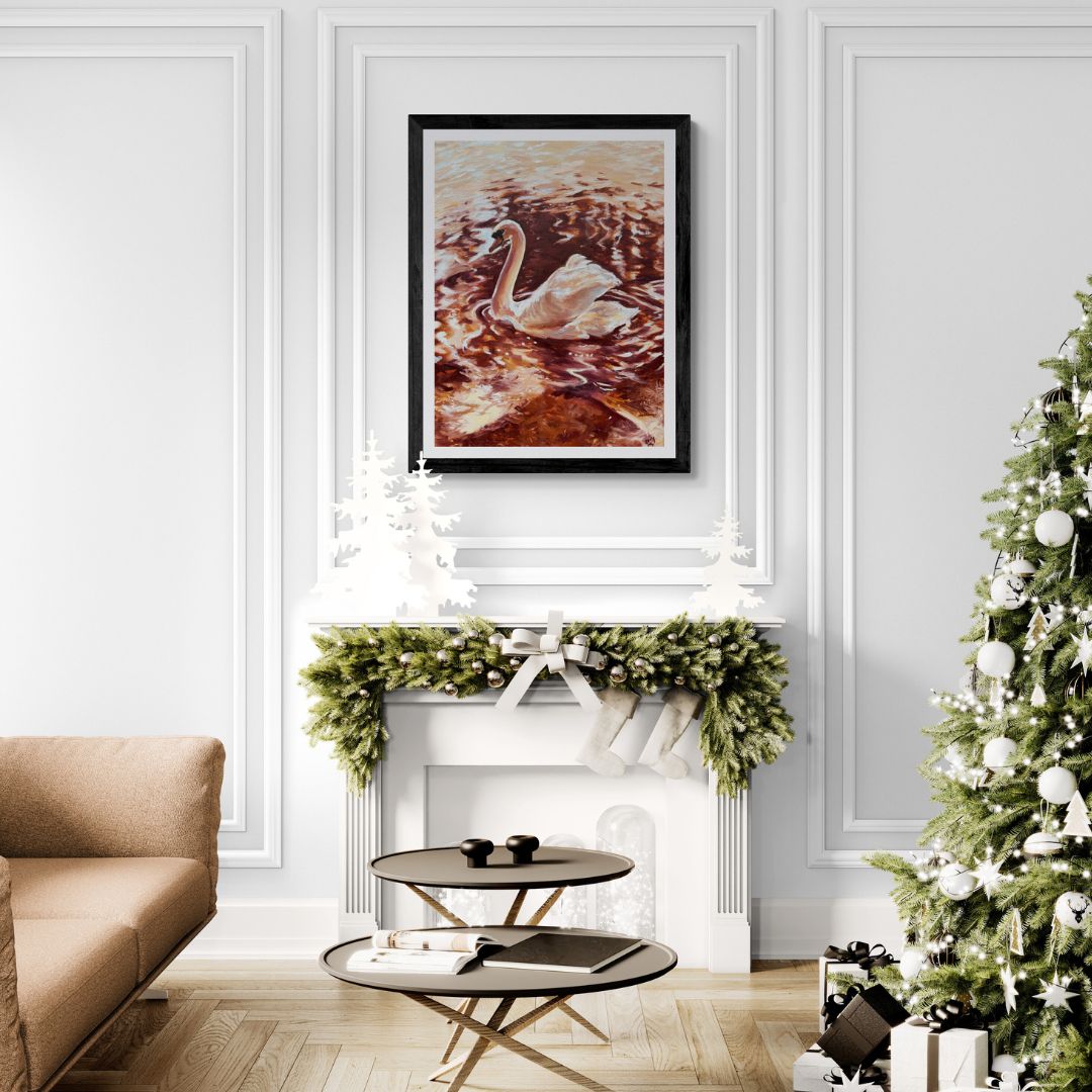 Living room with a decorated Christmas tree, beige sofa, and framed Swan artwork above a fireplace.