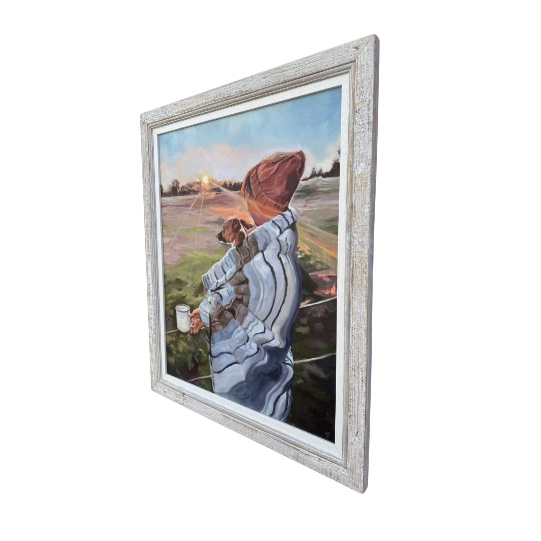 Right hand close up of framed original oil painting of a person with a Jack Russell dog watching the sun rise. 