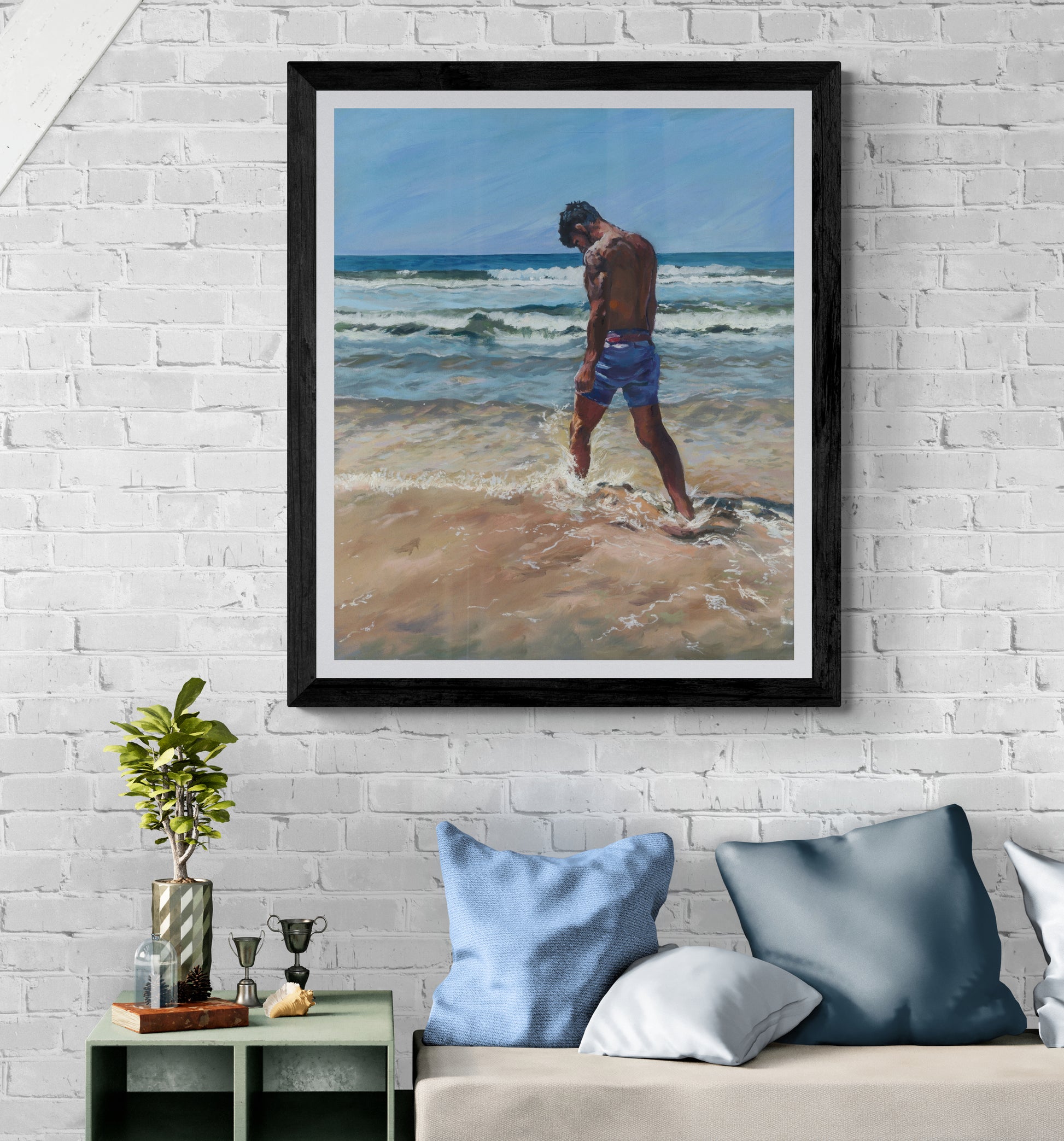 Surfer dude on a beach in Cornwall Fine art print in black frame
