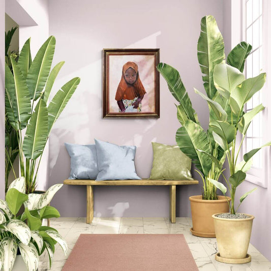 What She Carries framed oil painting of a little African girl displayed in a bright interior surrounded by tropical plants