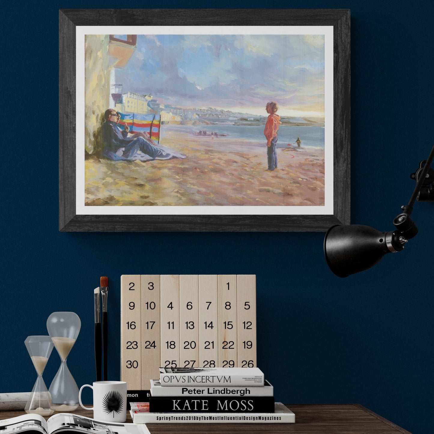 A man and his son discuss a kick around with a football in this fine art print of Porthmeor beach in Cornwall