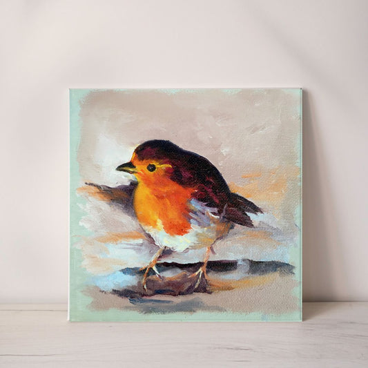 Painting of a robin on a light pastel coloured background