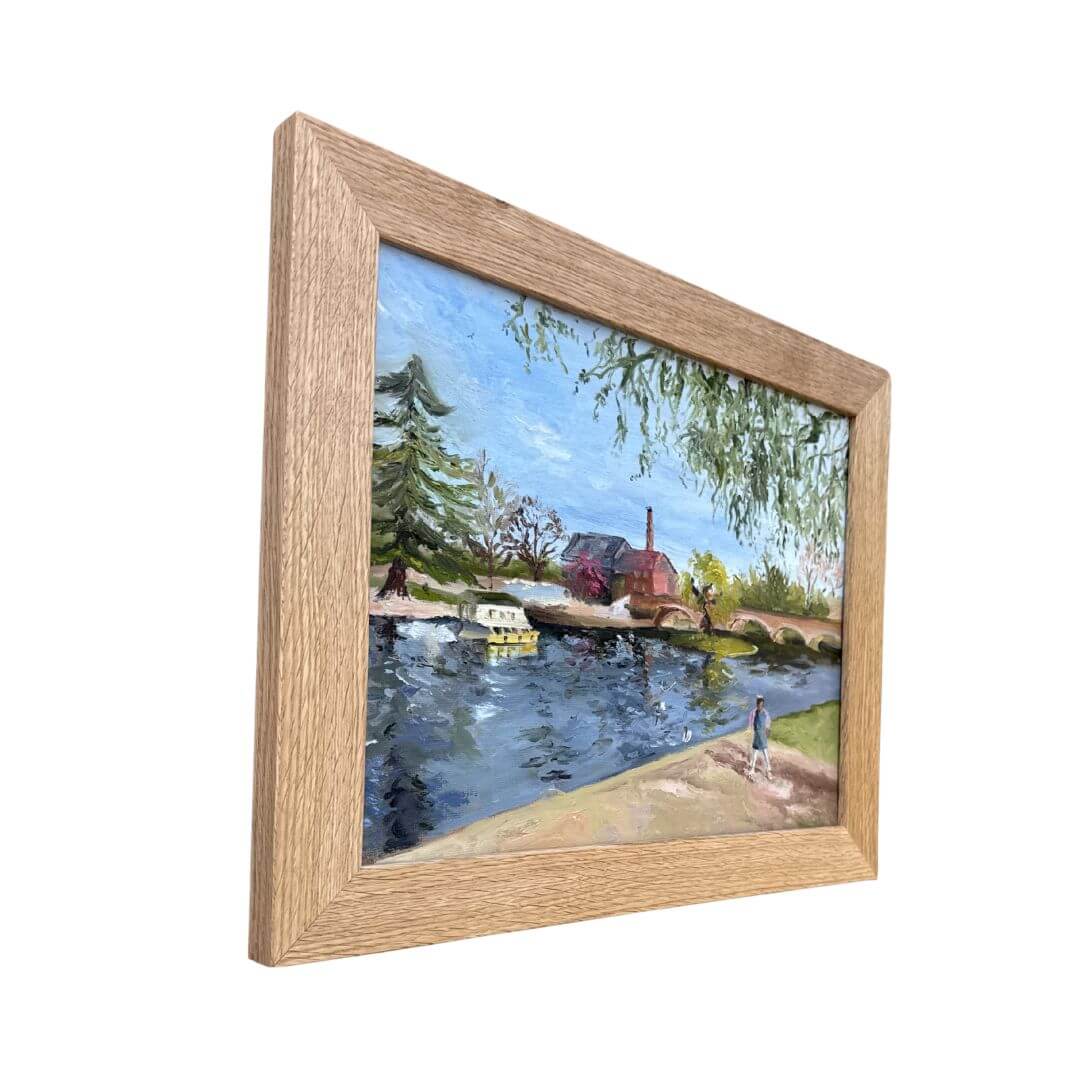 Left side view of framed Stratford-upon-Avon oil painting featuring a child by the River Avon at Bridge Foot.