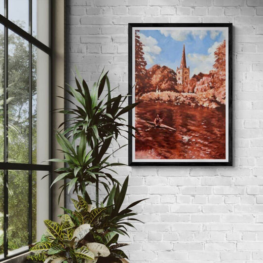 Framed fine art print of Holy Trinity Church beside the River Avon in Stratford-upon-Avon displayed on a white brick wall.