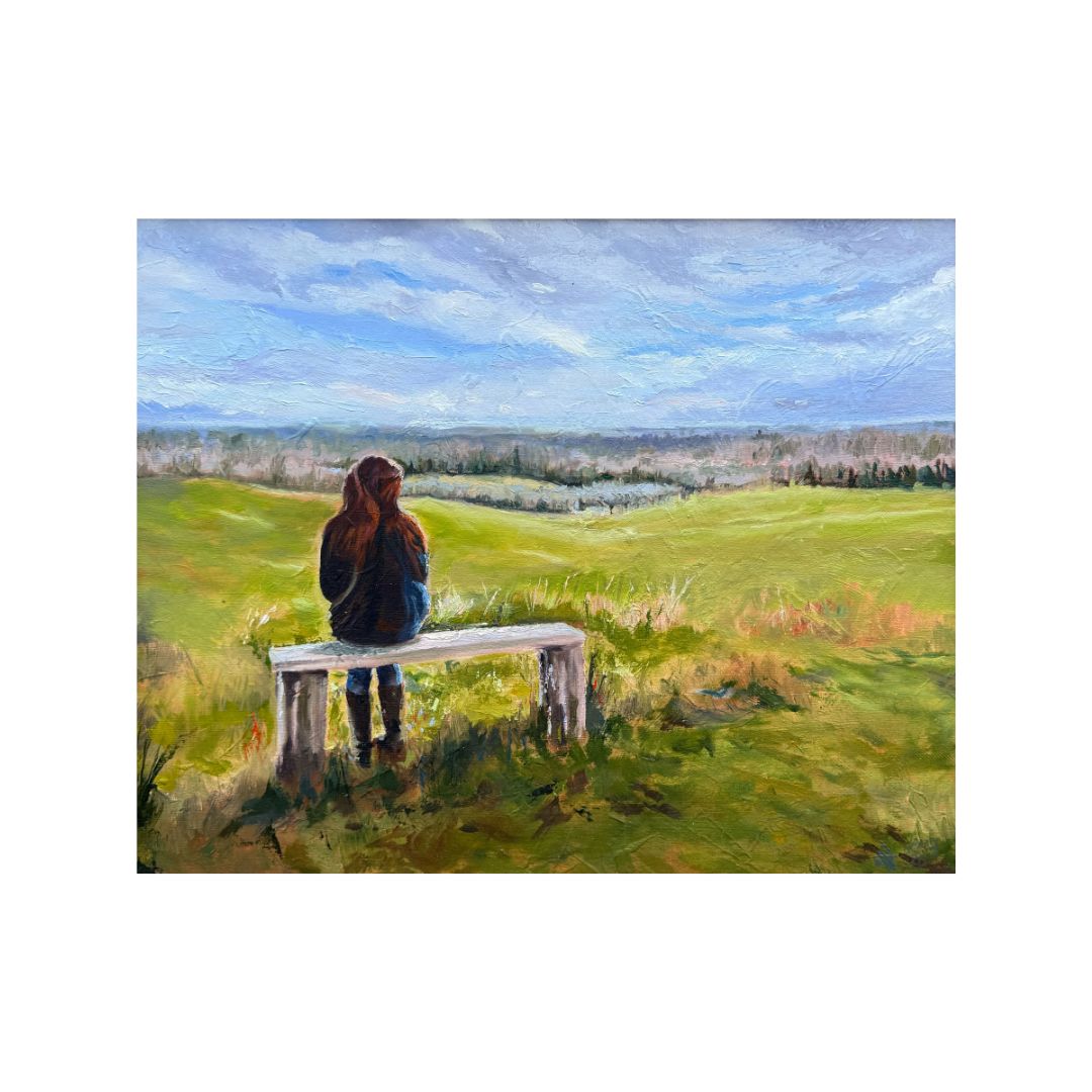 Original oil painting of a woman sitting on a bench overlooking the countryside, by British artist Lorraine Field.