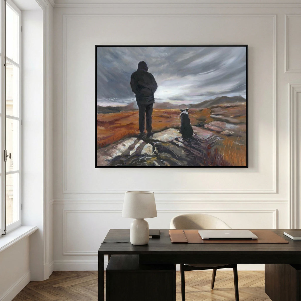 Man and His Border canvas print above a black desk against a white panelled wall
