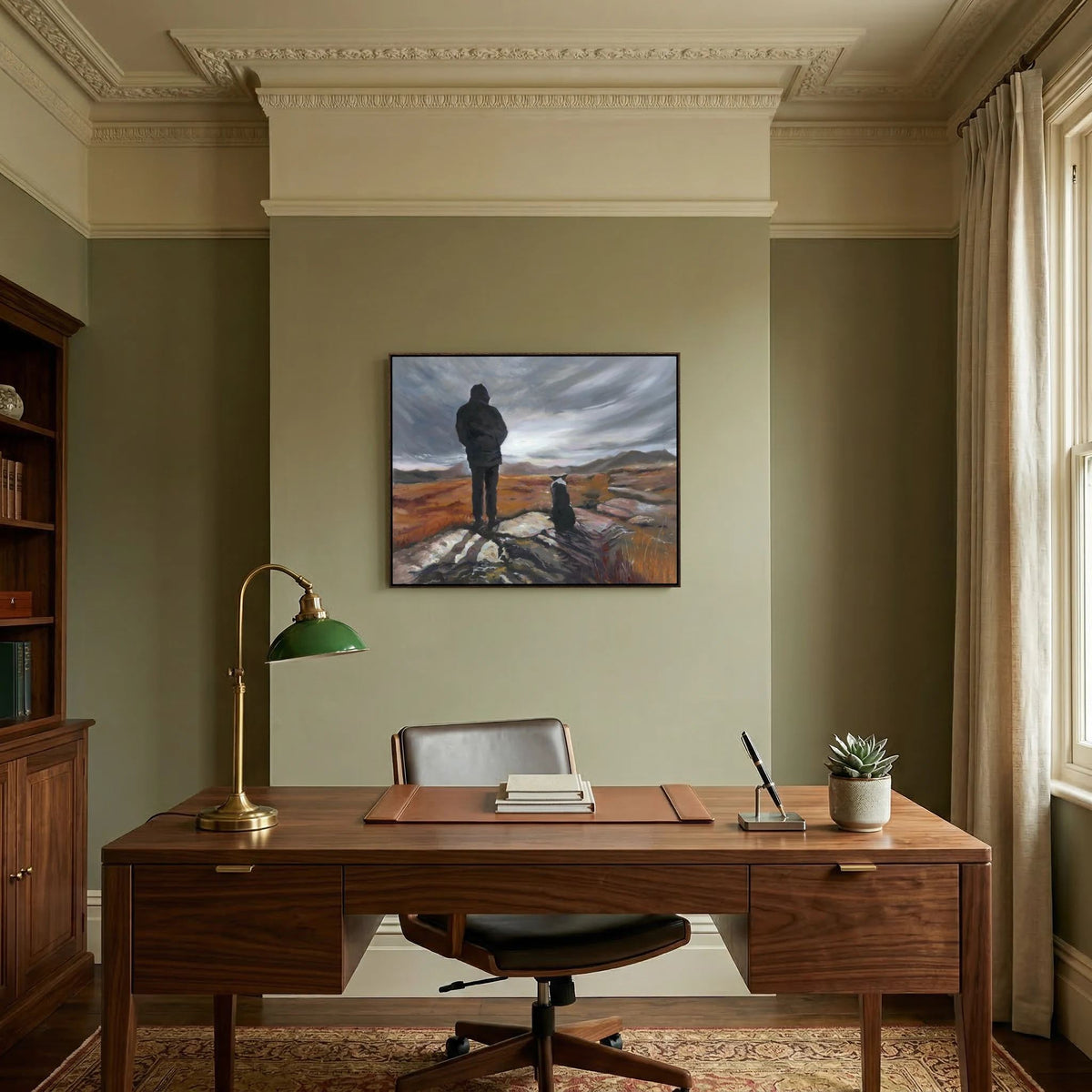 Man and His Border framed canvas print above a wooden desk in a home office with green walls.